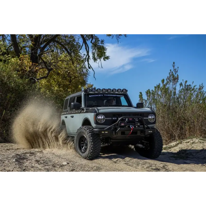 Mickey Thompson Baja Legend MTZ Tire driving on muddy trail