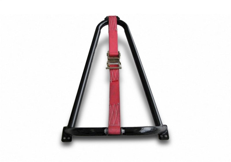 Bed mounted tire carrier with black and red luggage strap and gold buckle