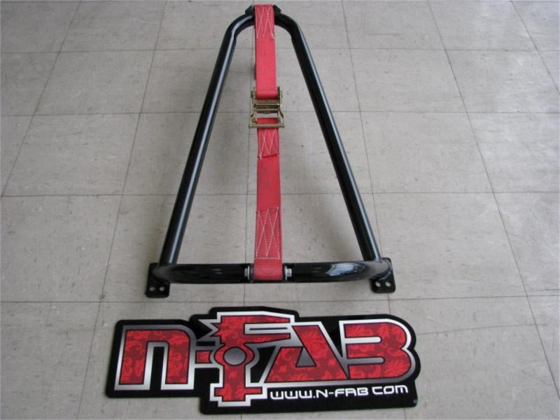 Red and black bed mounted tire carrier sign on ground - n-fab universal gloss black strap