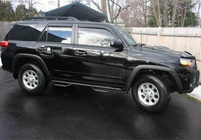 Black toyota 4runner suv with n-fab nerf step, w2w, 3in - parked in lot