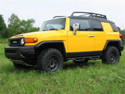 Yellow toyota fj truck parked in field - n-fab nerf step 06-17 toyota fj cruiser suv 4 door