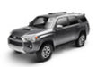 Black car parked in front of a white background with n-fab nerf step 10-17 toyota sr5 10-13 4 runner limited suv