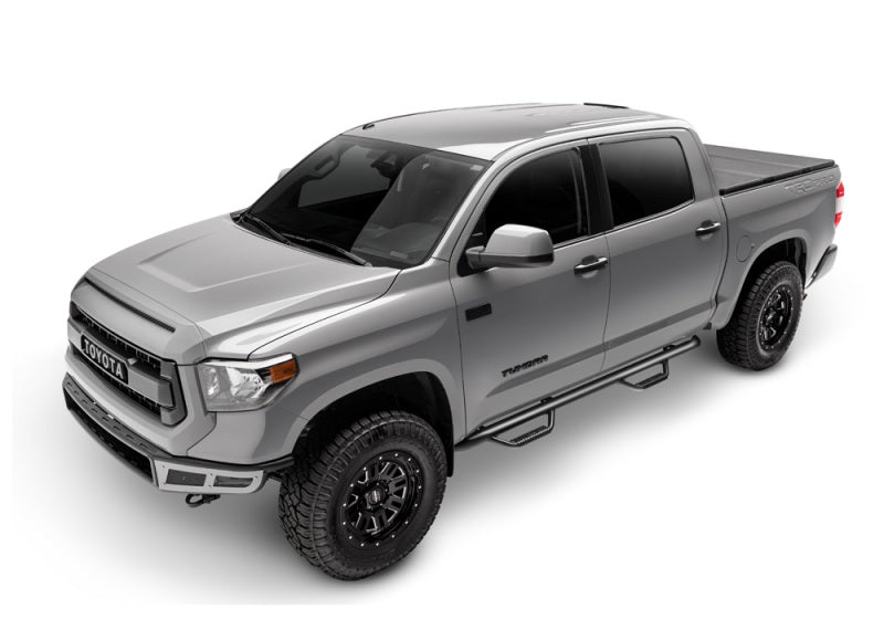 Gray truck with black wheels featuring n-fab nerf step for toyota tacoma double cab 6ft bed