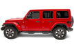 Red jeep wrangler with n-fab nerf step wheel nerf steps