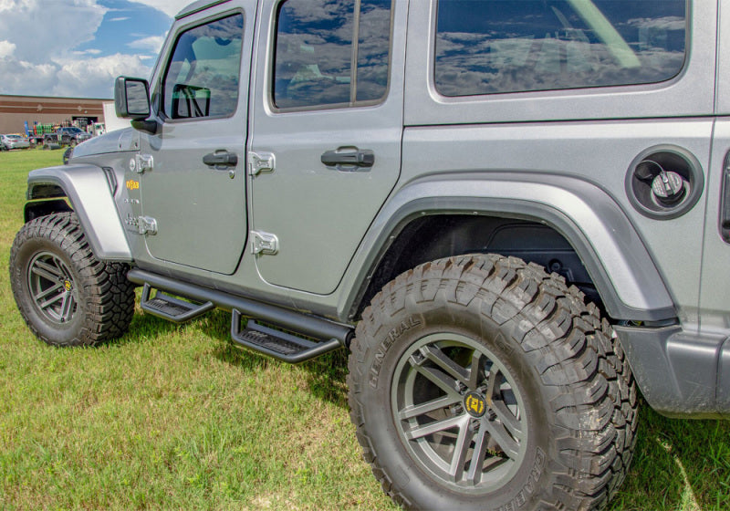 N-fab podium lg 2018 jeep wrangler jl 4dr suv parked in grass - step design, stainless steel