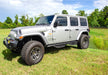 White jeep wrangler jl 4dr suv parked in field - n-fab podium lg - step design