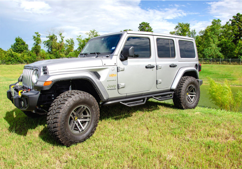 White jeep wrangler jt 4dr parked in field - n-fab podium lg step designtextcolorblack stainless steel 3in