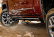 Red 2020 chevrolet colorado driving on dirt road - n-fab predator pro step system