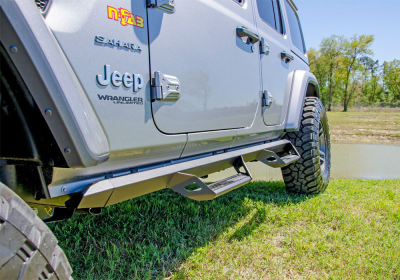 N-fab predator pro step system on 2018 jeep wrangler jl 4 door suv by the water