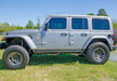 N-fab predator pro step system on jeep wrangler in field
