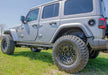 N-fab rkr rails on jeep wrangler jl in field - gloss black - 1.75in