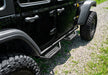 Black tire cover on jeep wrangler jl with n-fab rs nerf step, cab length nerf steps