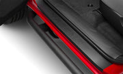 Red rear door handle on n-fab trail slider steps for toyota tacoma in textured black