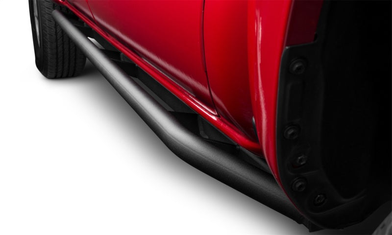 Red car rear bumper with n-fab trail slider steps in textured black