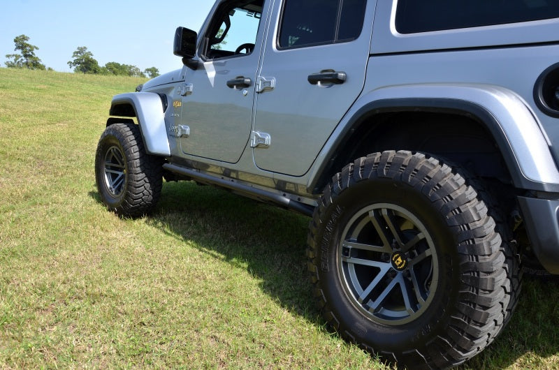 N-fab trailslider steps in textured black on jeep wrangler in field