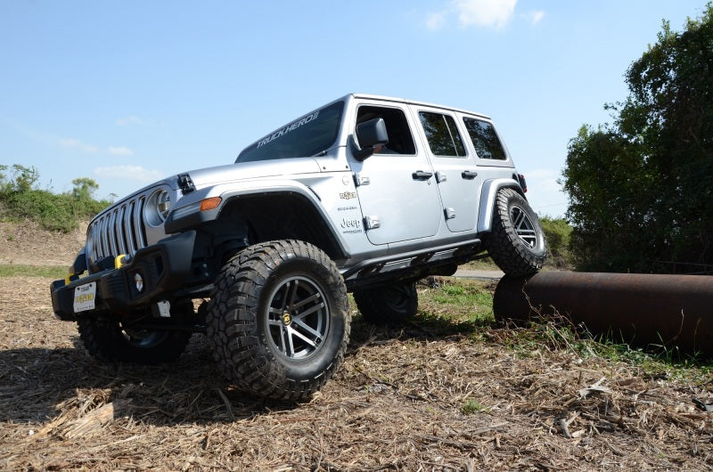 White jeep wrangler jl parked in a field - n-fab trailslider textured black