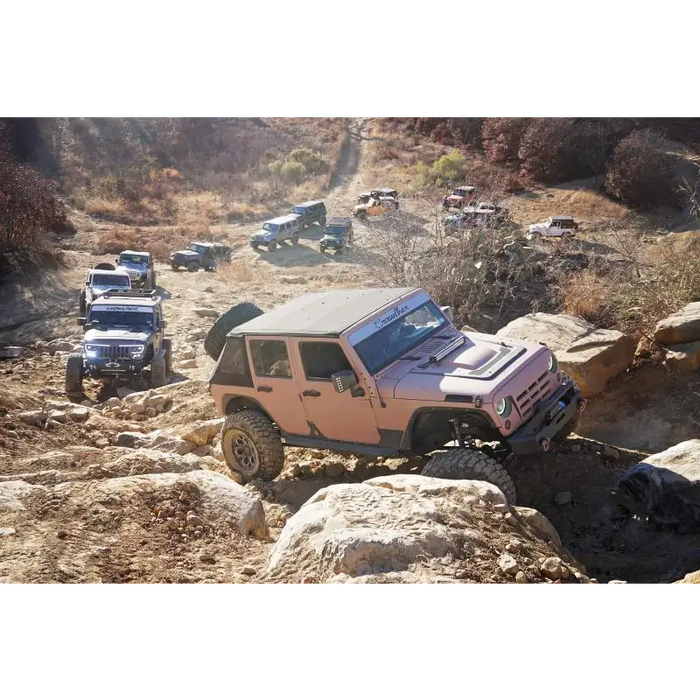 Jeep Wrangler JK driving on rocky trail.