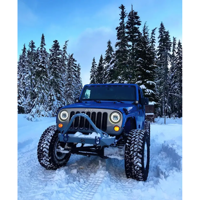 Blue Jeep Wrangler JK Switchback LED Halo Headlights in Snow