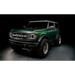 Green lifted truck with black bumper featuring Oracle 2021+ Ford Bronco Integrated Windshield Roof LED Light Bar System