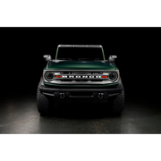 Green jeep with Oracle 2021+ Ford Bronco Integrated Windshield Roof LED Light Bar System