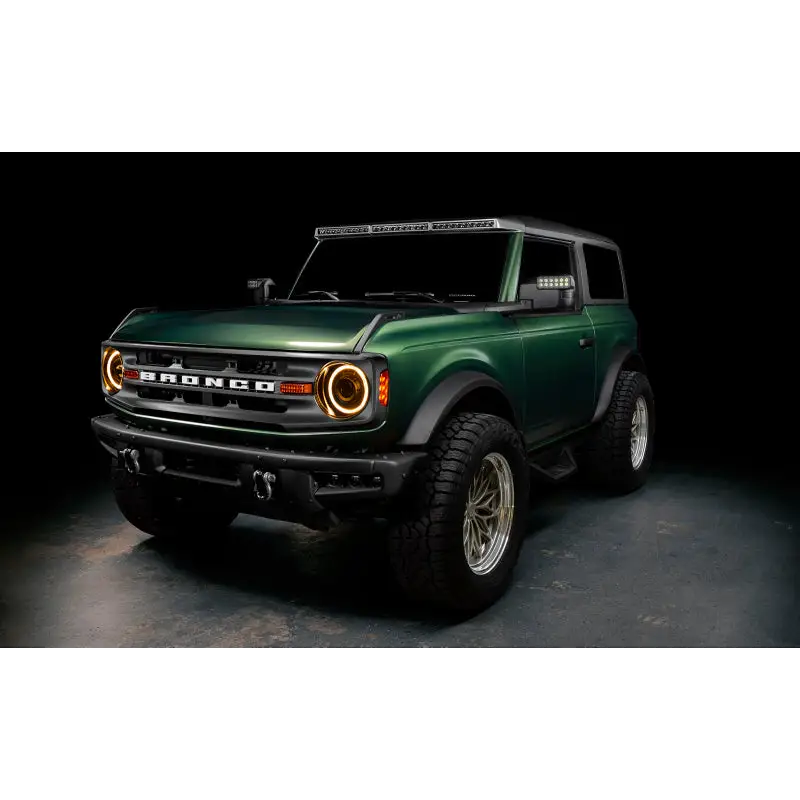 Green lifted truck with black bumper featuring Oracle 2021+ Ford Bronco Oculus BI-LED Projector Headlights
