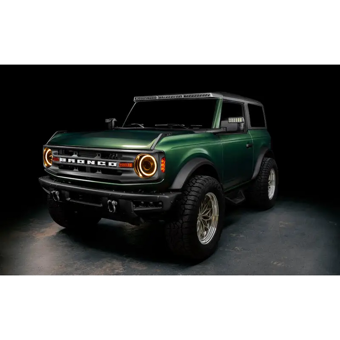 Green lifted truck with black bumper featuring Oracle 2021+ Ford Bronco Oculus BI-LED Projector Headlights