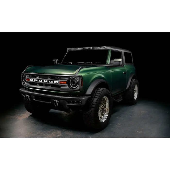 Green lifted truck with black bumper, Oracle 2021+ Ford Bronco Oculus BI-LED Projector Headlights.