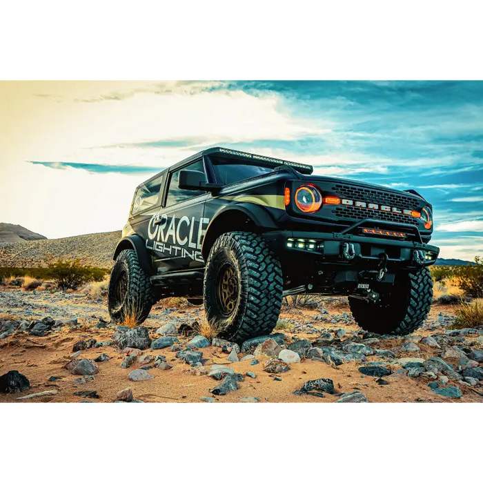 Black truck with black bumper featuring a white lettering on it.