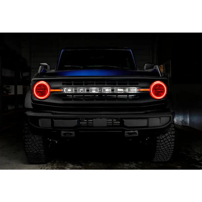 Black truck with blue tail light, Oracle 21-22 Ford Bronco Headlight Halo Kit with DRL Bar.