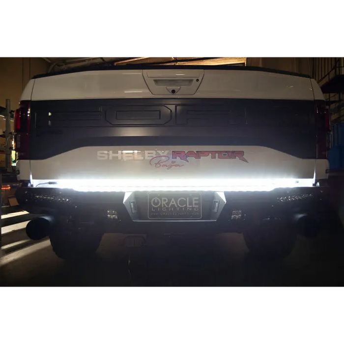 White truck with LED tailgate light bar by Oracle - double row LED truck accessory