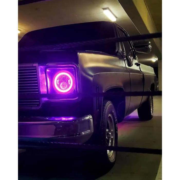 Oracle 7in High Powered LED Headlights with Purple Lights on Truck