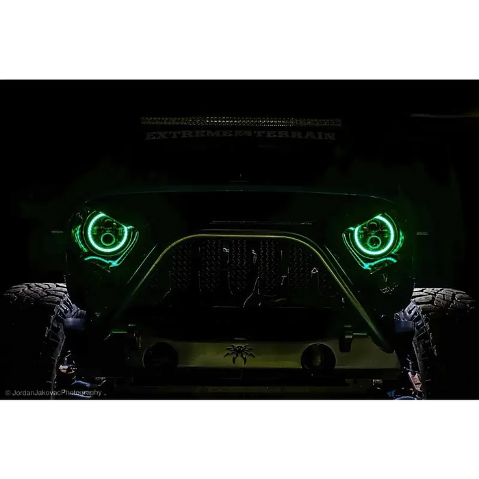 Oracle 7in High Powered LED Headlights with ColorSHIFT 2.0 - Front View of Jeep with Green Lights