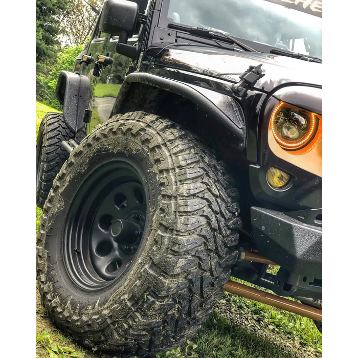 Jeep with mud tires and Oracle 7in High Powered LED Headlights