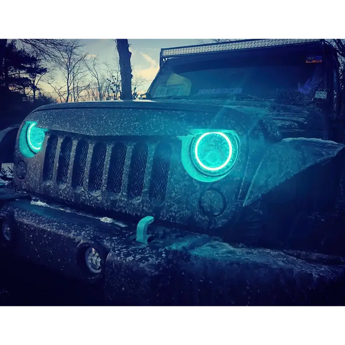 Green light illuminated Jeep with Oracle 7in High Powered LED Headlights in ColorSHIFT 2.0