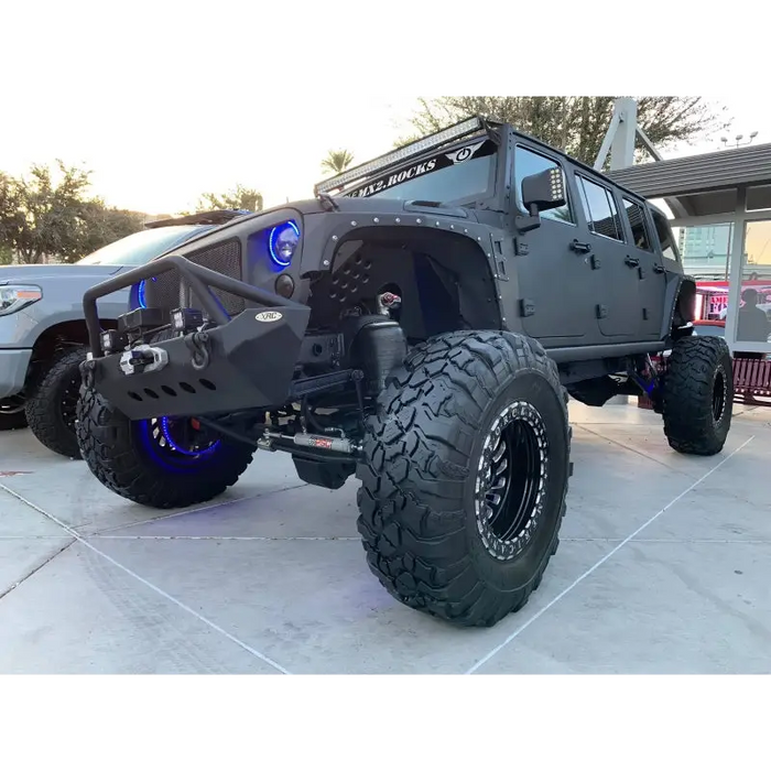 Black Jeep with Big Tires featuring Oracle 7in High Powered LED Headlights