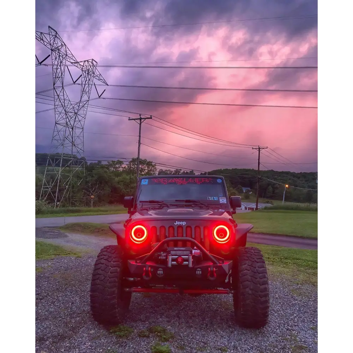 LED headlights for Jeep Wrangler with red light on circuit board.