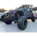 Black Jeep with Big Tires showcasing Oracle 7in High Powered LED Headlights for Jeep Wrangler