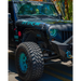 Oracle 7in High Powered LED Headlights on a Jeep with Blue and Black Decal