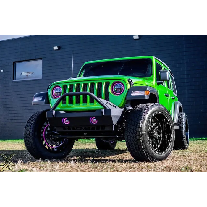 Green Jeep with Black Rim and Pink Bumper featuring Oracle 7in High Powered LED Headlights for Jeep Wrangler