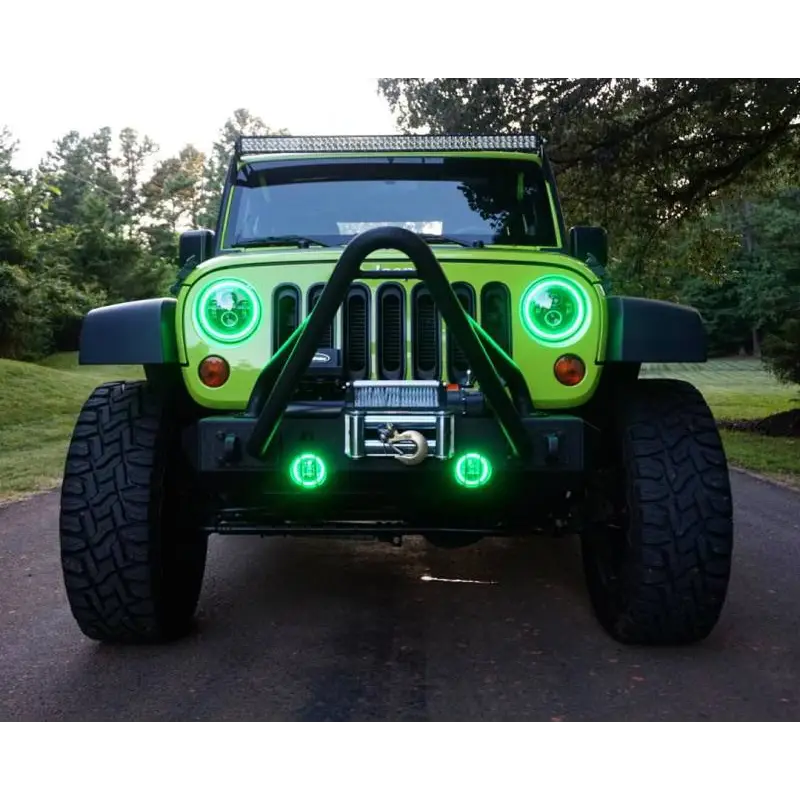 Customized Jeep Wrangler with Green LED Lights on a Black Bezel Oracle 7in High Powered LED Headlights