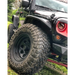 Black Oracle 7in LED Headlights on Dynamic Jeep in Grass