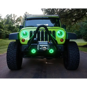 Dynamic green LED lights on Oracle 7in High Powered LED Headlights with black bezel.