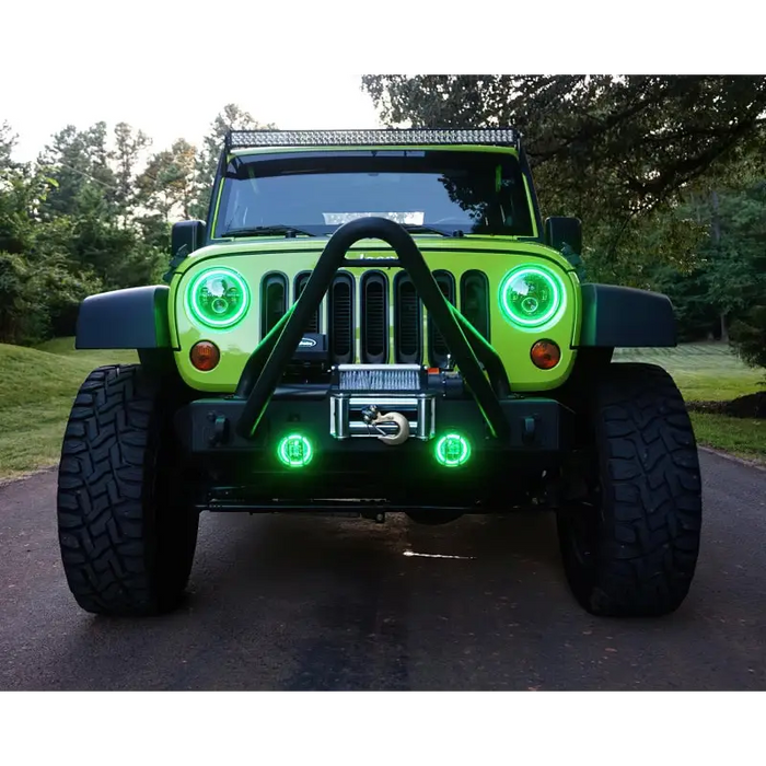 Dynamic green LED lights on Oracle 7in High Powered LED Headlights with black bezel.