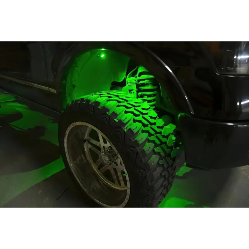 ColorSHIFT rock light kit bright green glow on truck.