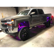 Silver truck with purple lights - Oracle Bluetooth + RF Underbody Rock Light Kit - 8 PCS - ColorSHIFT.