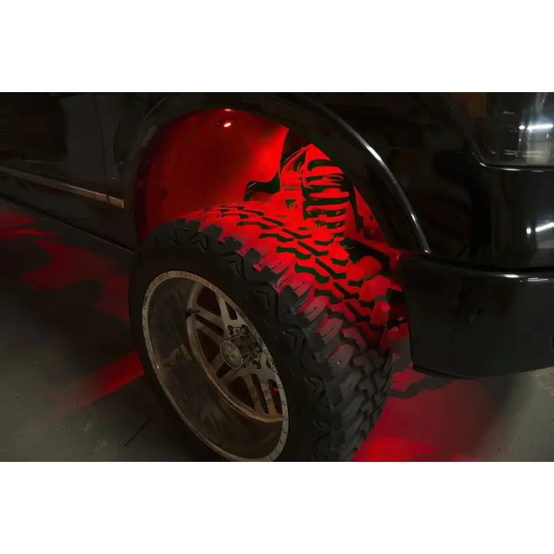 Red LED rock light on black truck - Oracle Bluetooth + RF Underbody Rock Light Kit - 8 PCS ColorSHIFT