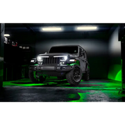 Jeep with green lights in dark room - Oracle Bluetooth Rock Light Kit