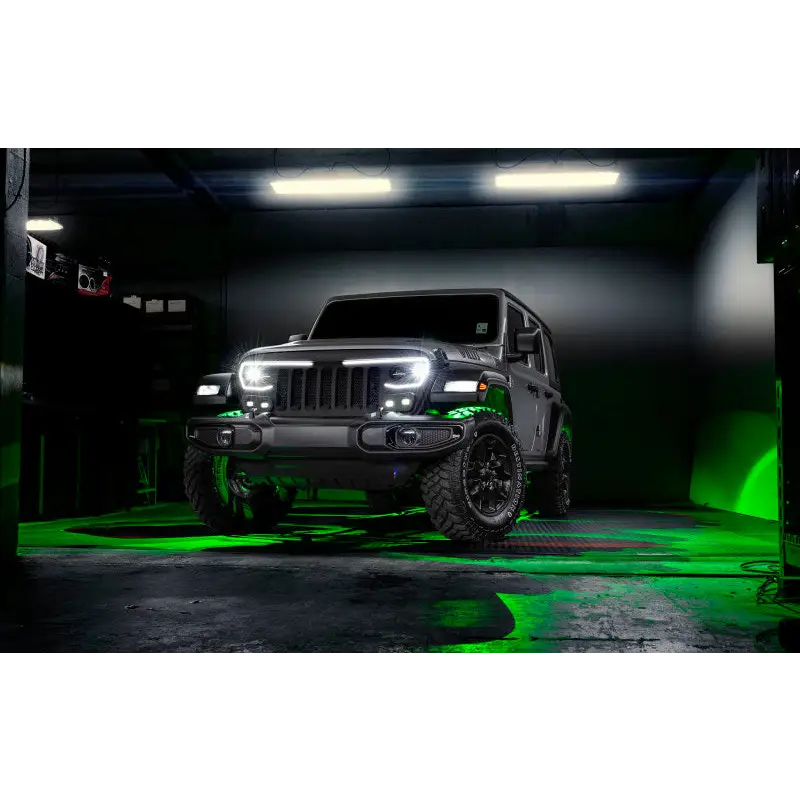 Jeep with green lights in dark room - Oracle Bluetooth Rock Light Kit