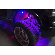 Black car with purple LED rock light kit, Oracle Bluetooth + RF Underbody Rock Light Kit - 8 PCS - ColorSHIFT.