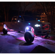Oracle Bluetooth + RF Underbody Rock Light Kit - 8 PCS - ColorSHIFT - truck with lights on and truck in background.